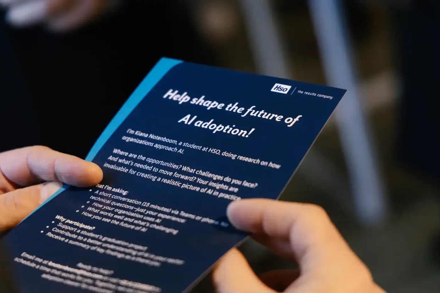 Printed event material in a guest’s hands